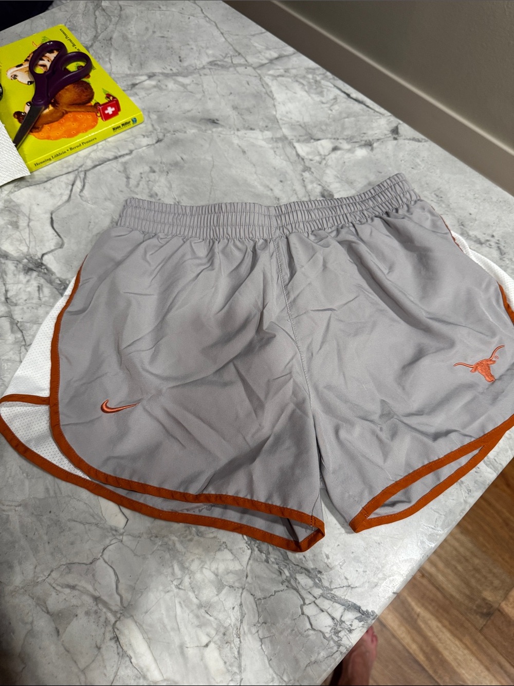 Nike Women’s Light Gray Athletic Shorts with Orange Trim